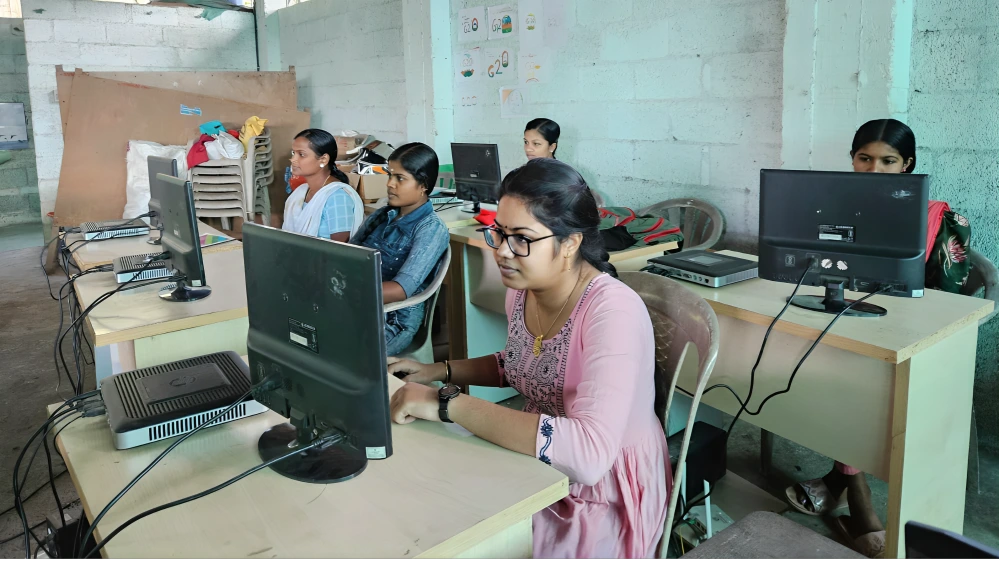 Tribal women learning computer skills at Swami Vivekananda Medical Mission, supported by Apni Pathshala.