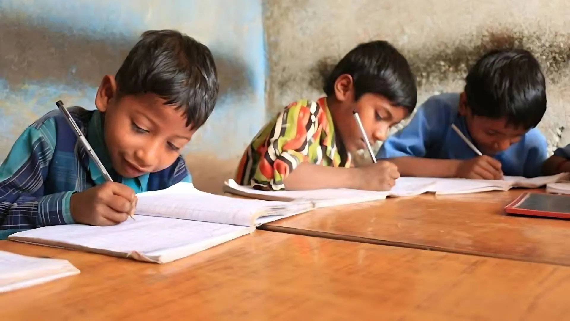 Students writing on their notebooks.