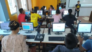 Children studying together on personal computers in a community microschool.